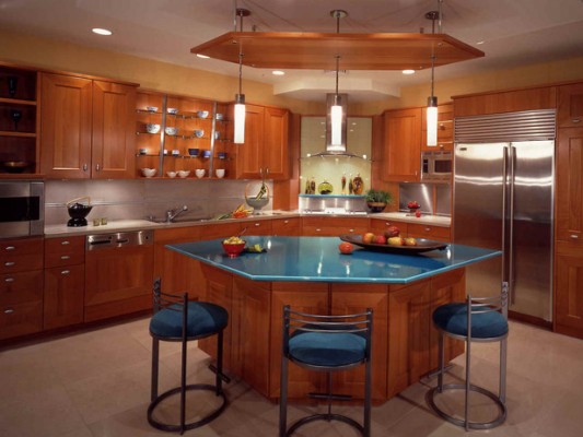 A kitchen featuring a blue island.