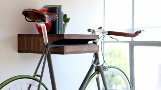 A bicycle with a wooden shelf attached for storage.