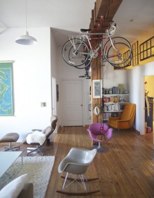 A living room with creative bicycle storage.