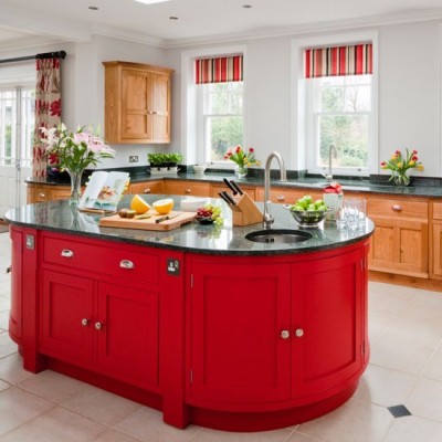 A red kitchen with a matching island.
