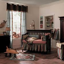 A baby's room with a crib and dresser.
