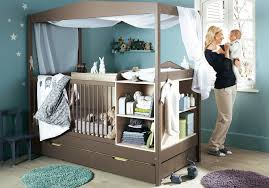 A baby's room with a cot and bookshelf.