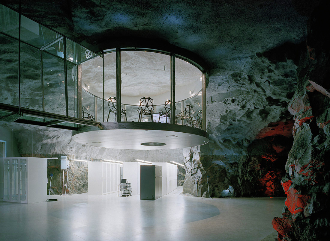 Modern interior cave architecture with circular glass balcony