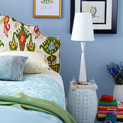 Styling a bedside table with a colorful headboard.
