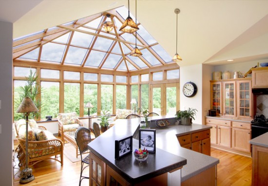 A sunroom off the kitchen adds light and space (Petkusbrothers)