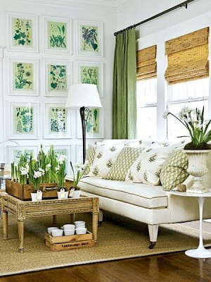 A living room with white furniture and green plants, perfect for spring.