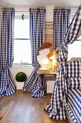 A spring-themed bedroom with a blue and white checkered canopy bed.