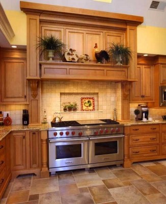 A traditional kitchen with wooden cabinets and a stove.