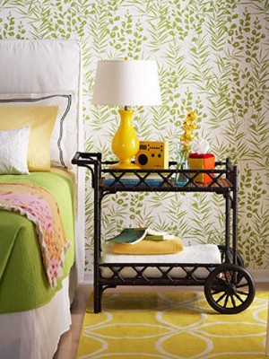 Styling a green and yellow bedroom with a bed and choosing the perfect bedside table.