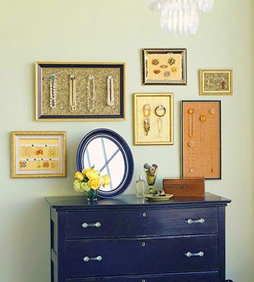 A dresser with framed picture frames on it.