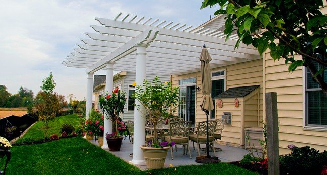 A house with a pergola for backyard entertaining.
