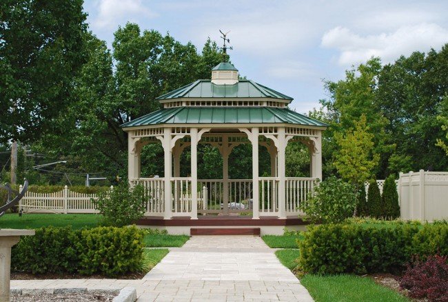 A traditional gazebo offers grace to the garden 