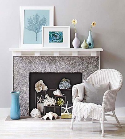 A selection of seashells looks great in the summer fireplace 