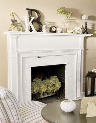 Fresh blooms accent this off-season fireplace