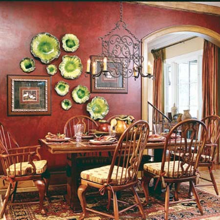 Green plates work well with artwork in this dining room