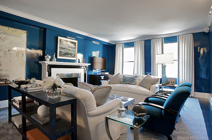 A living room with high gloss blue walls.