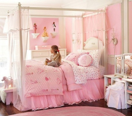 A girl's colorful bedroom with a canopy bed.