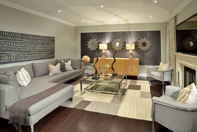 A living room showcasing the basics of interior design with a gray couch and coffee table.