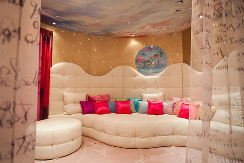 A white couch in a diva den.