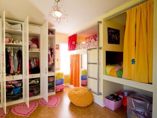 A girl's bedroom with ample storage space.