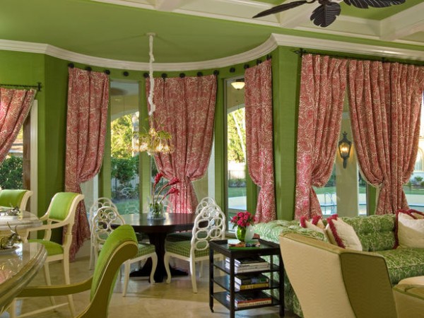 Contrasting color of window treatments make this room pop