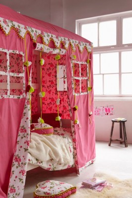 A pink tent in a girl's bedroom.