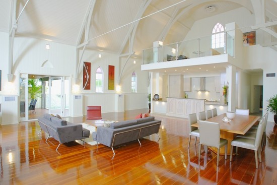 A wooden floor in a converted church home design.