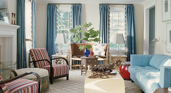 A living room with blue curtains.