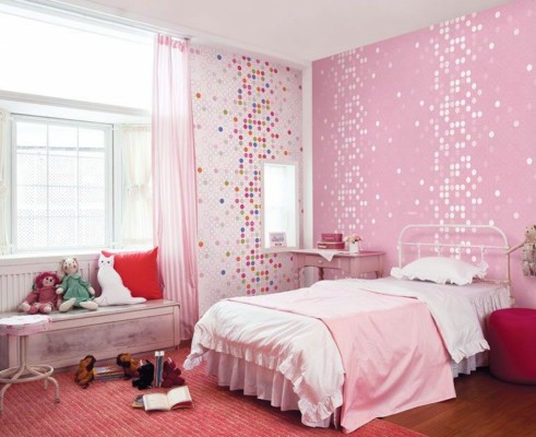 A pink and white girl's bedroom.