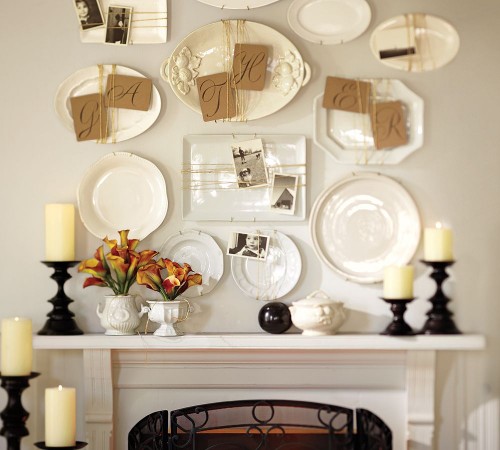 Plates embellished with mementoes add charming detail over the fireplace