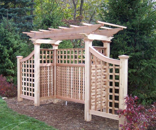 A pergola adds structure to the backyard garden