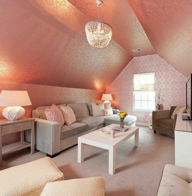 A Diva den with pink walls and a chandelier.