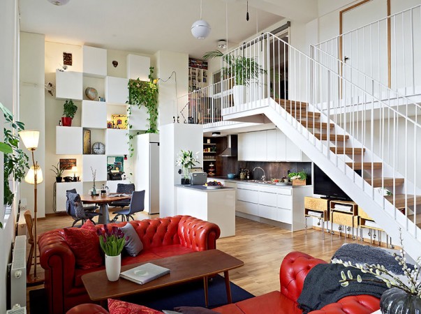 A loft space with a red couch.