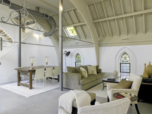A church living room with a large window, showcasing a church to home design conversion.