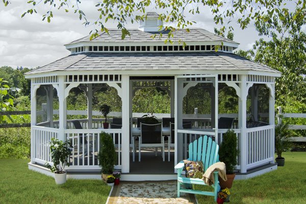 A gazebo in a grassy area, perfect for backyard entertaining.