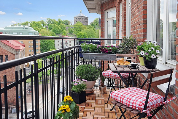 Apartment balcony with flowers.