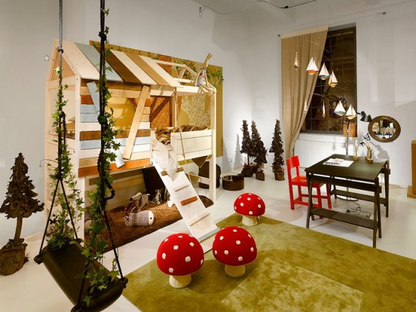 Whimsical interiors with a tree house and a bunk bed in a children's room.