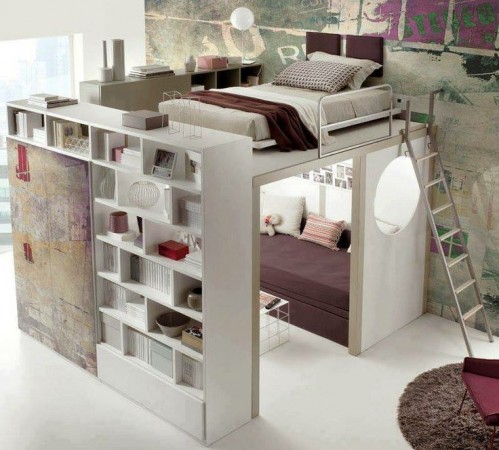 A small bedroom with a loft bed and bookshelf, featuring loft space.
