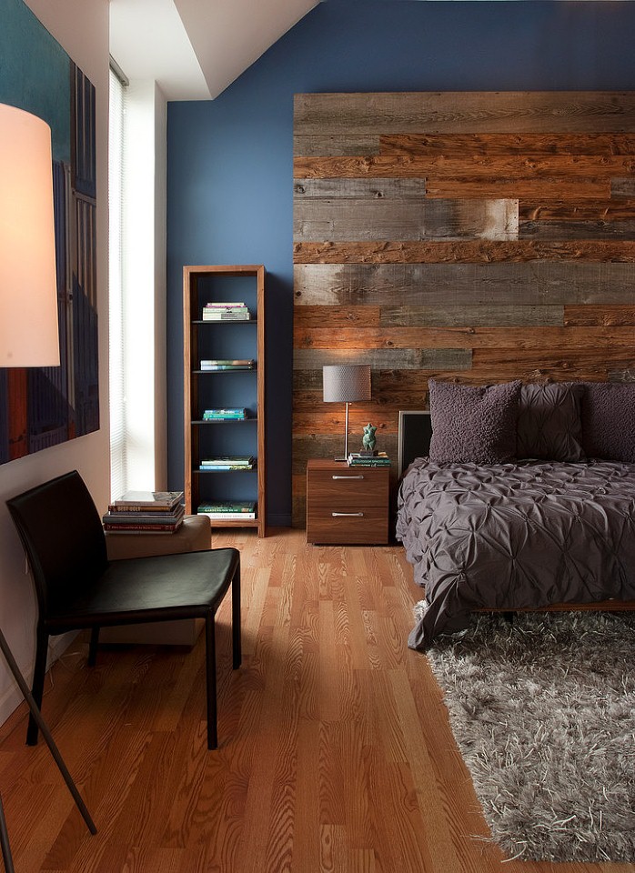 A bedroom featuring natural wood in its wall.