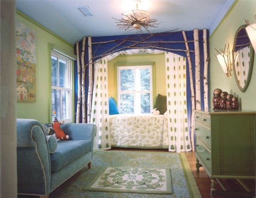 A blue couch in a girl's bedroom.