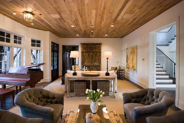 A living room featuring a natural wood ceiling.