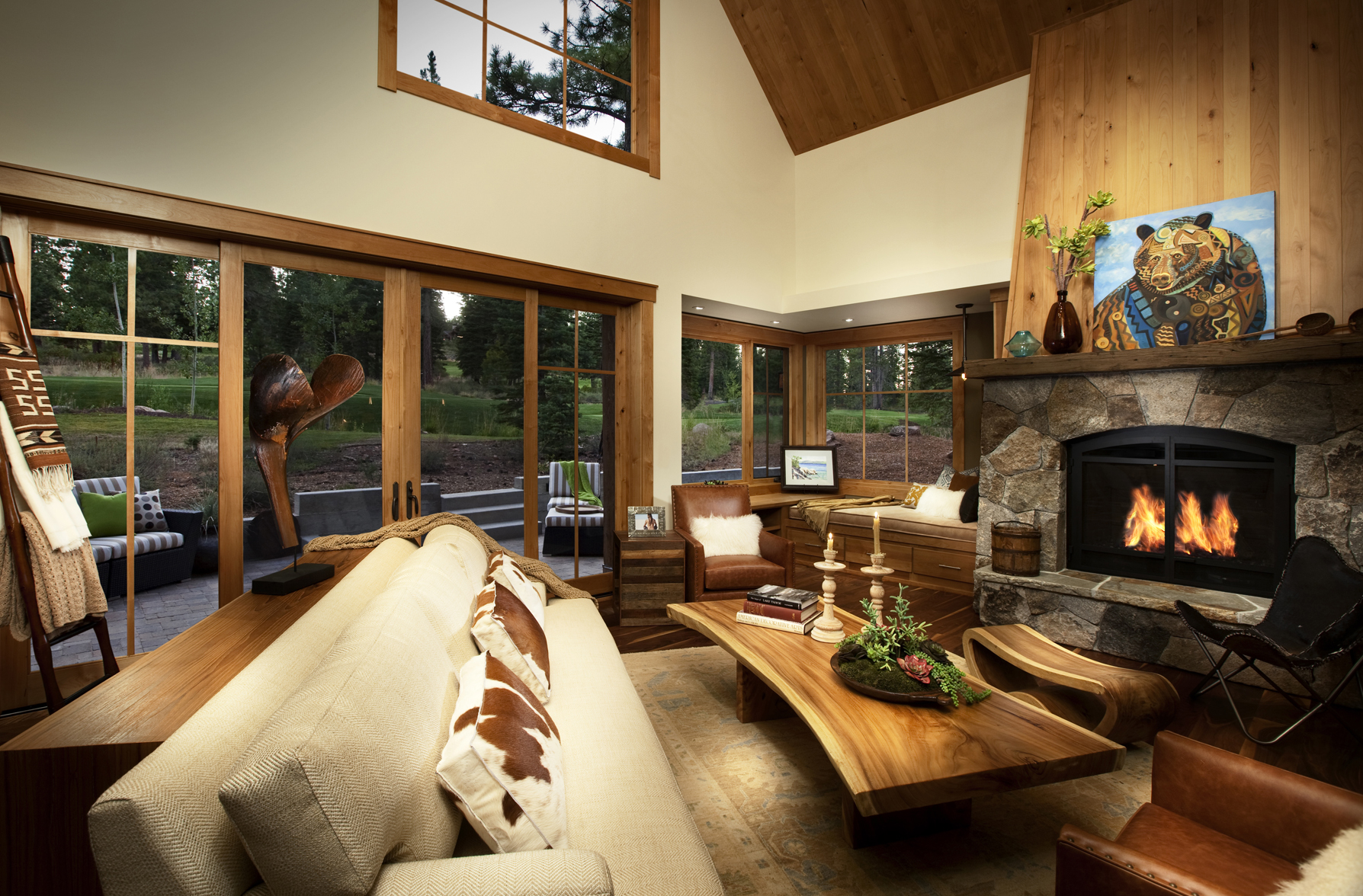 A cozy living room with a natural wood fireplace.