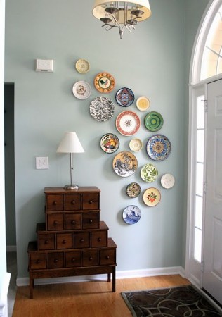 An asymmetrical plate display works well in this foyer space 
