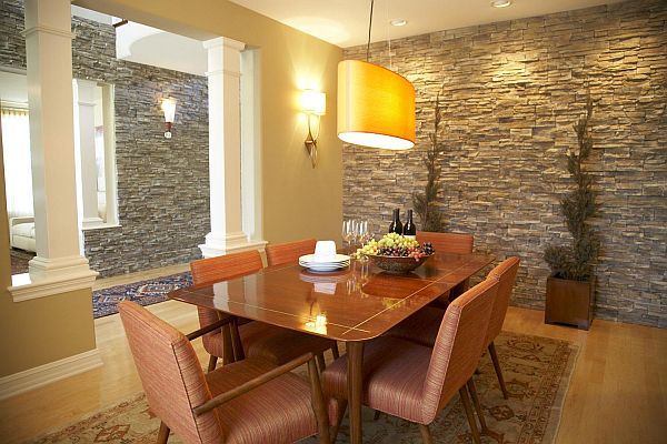 A dining room with stone interior accents.