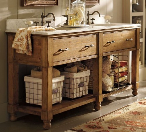 Staging your home with a bathroom vanity featuring baskets and a mirror.
