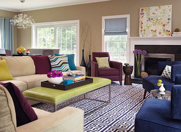 A living room with colorful furniture and decorative pillows.