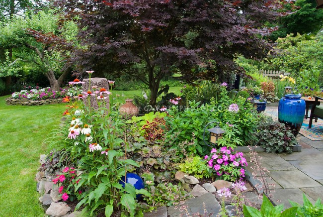 Beautiful blooms enhance this raised garden area