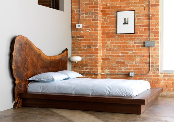 A recycled piece of wood makes a stylish headboard 
