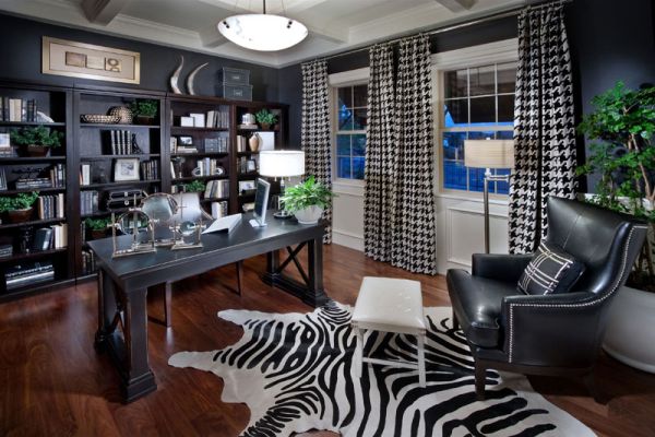 A masculine home office with a zebra print rug.