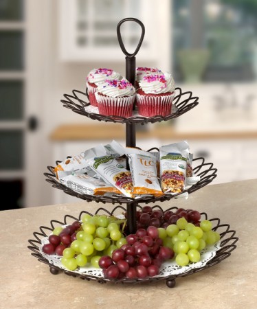 Three tiered tray with grapes and cupcakes, perfect for staging your home.